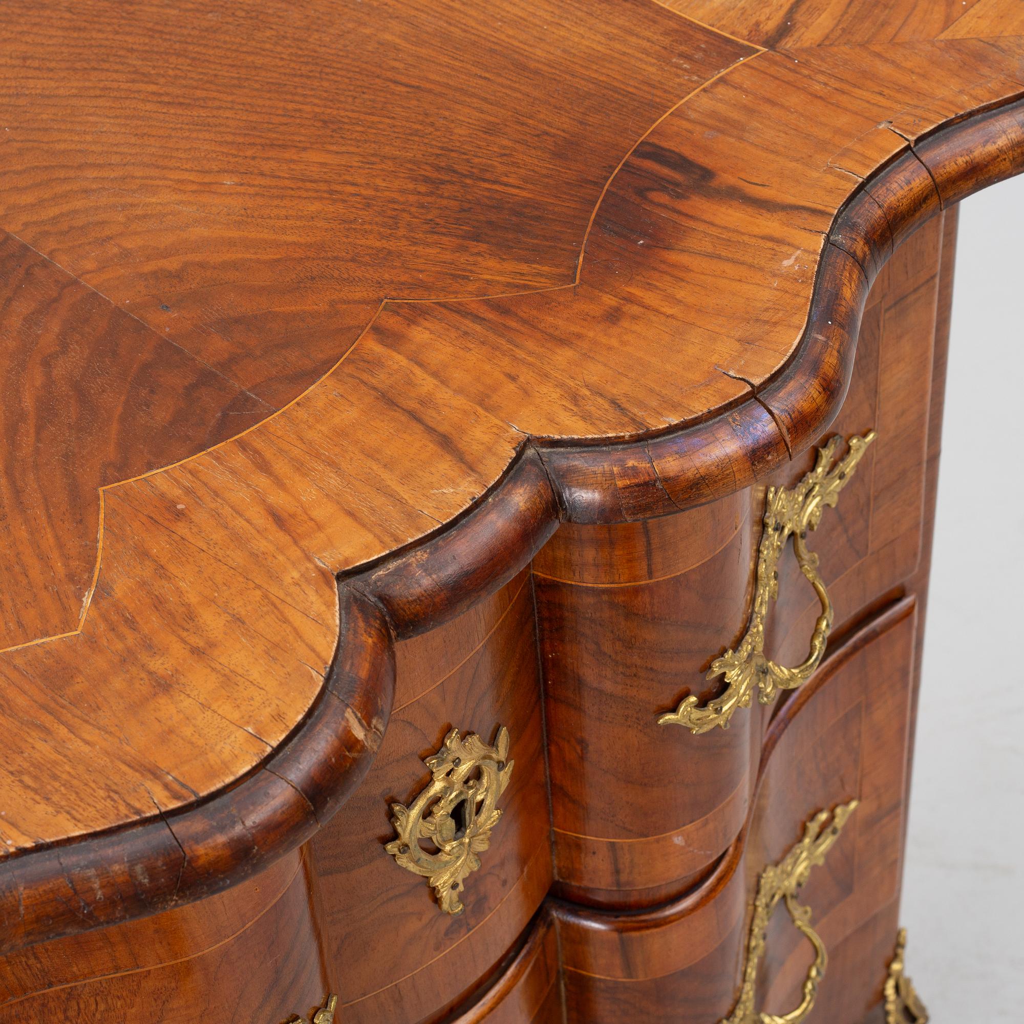 A Rococo-style chest of drawers, 19th century.