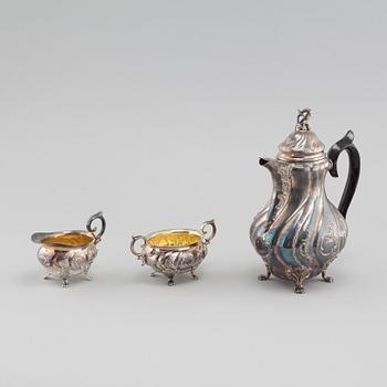 A silver rococo style coffee pot, sugar bowl and creamer from GAB and C G Hallberg in Stockholm, 1950s/60s.
