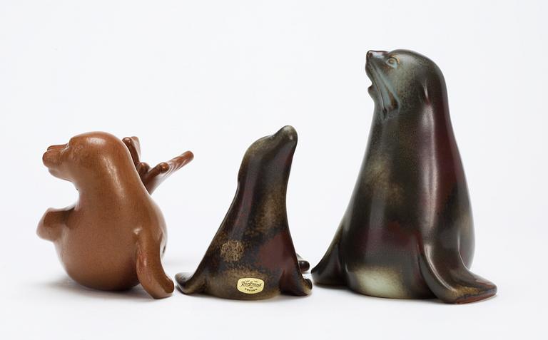 Three Gunnar Nylund stoneware figures of seals, Rörstrand.