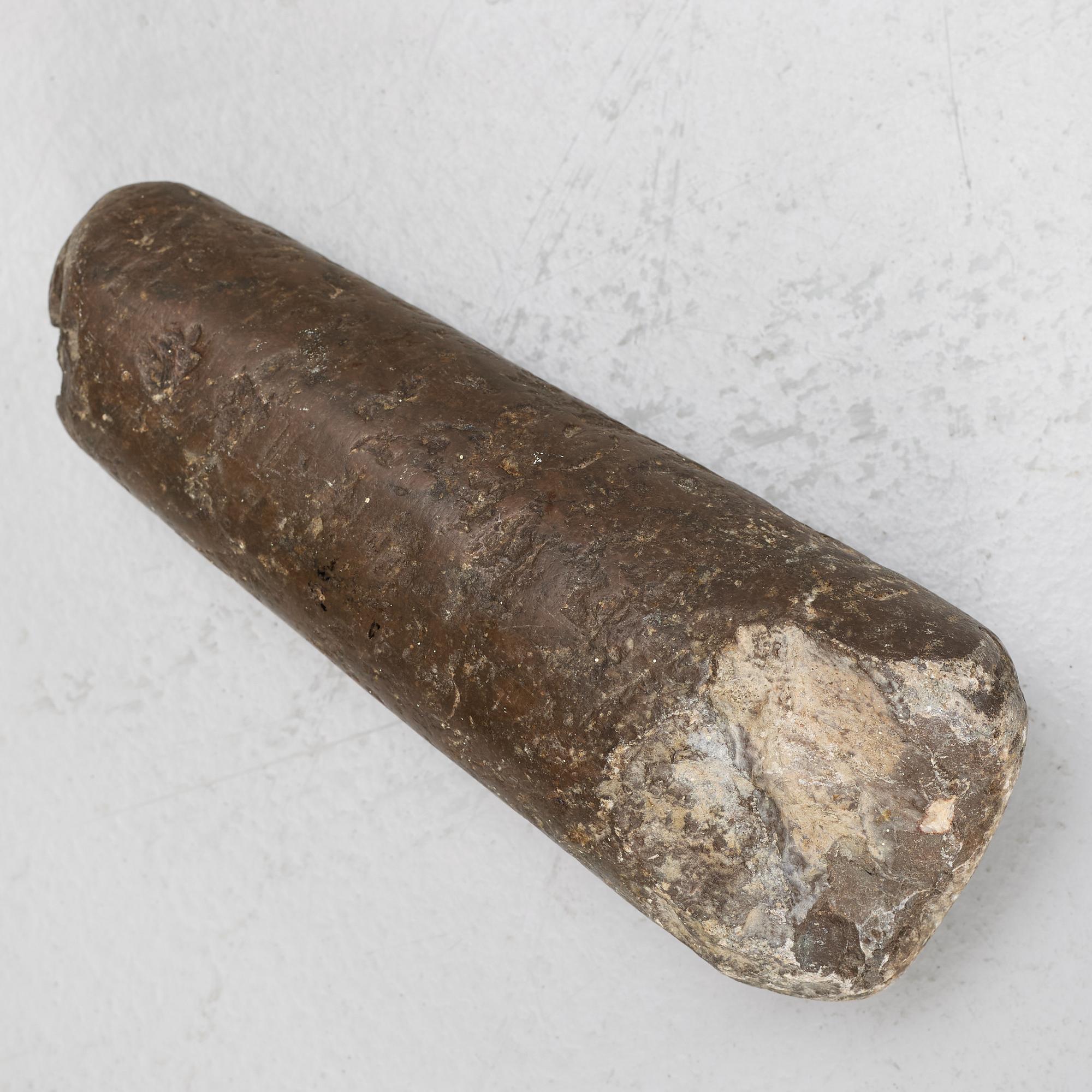 A llimestone mortar and pestle, 18th/19th Century.