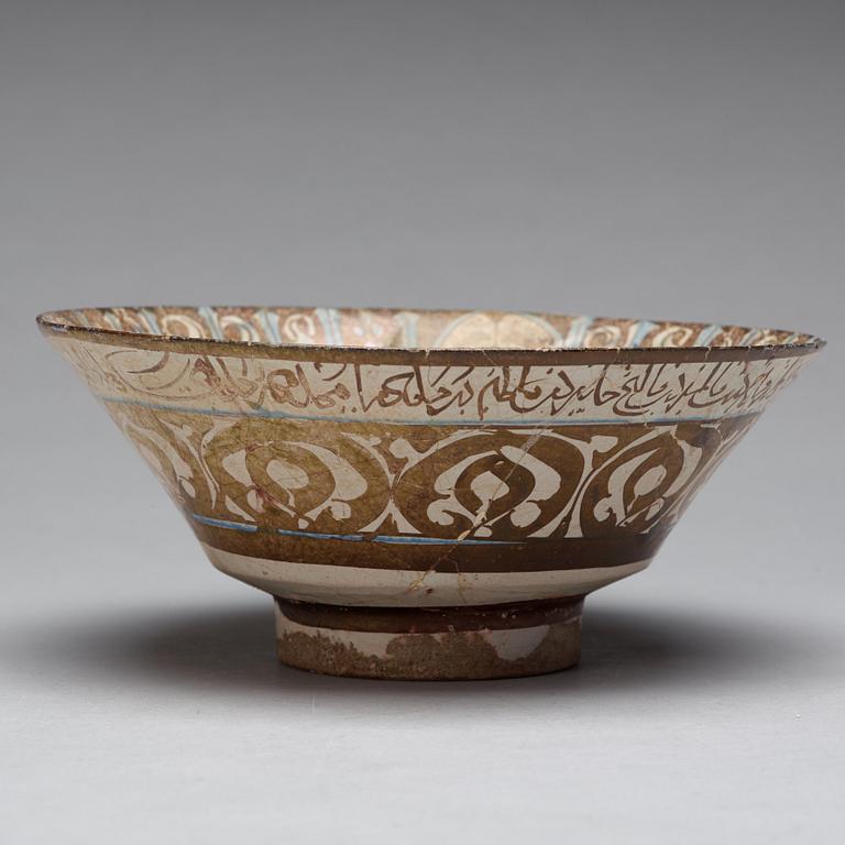 A BOWL, pottery with luster decor and blue, height ca 10 cm, diameter ca 23,5 cm, Kashan style, Persia/Iran 13th.