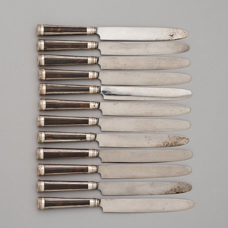 A set of twelve Swedish early 19th century turtle and silver dinner-knifes.