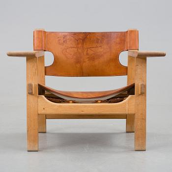 A Børge Mogensen oak and leather 'Spanish Chair' by Fredericia Stolefabrik, Denmark.
