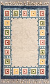 A Swedish flat weave carpet signed Erik Lundberg 245x168 cm.