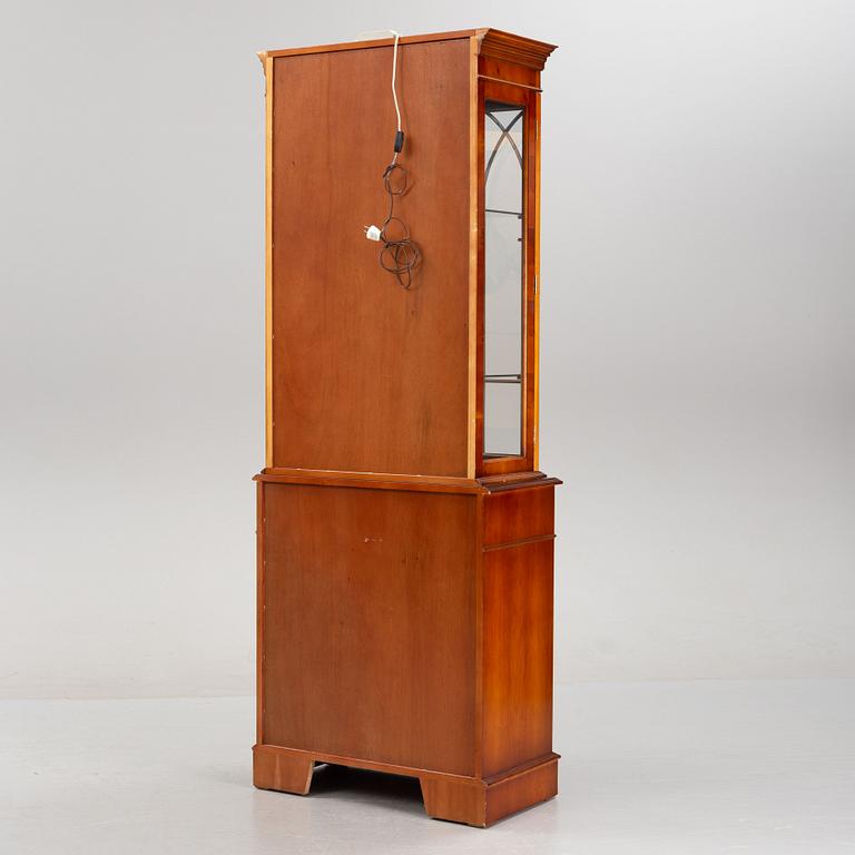 An English yew cabinet, 21st Century.