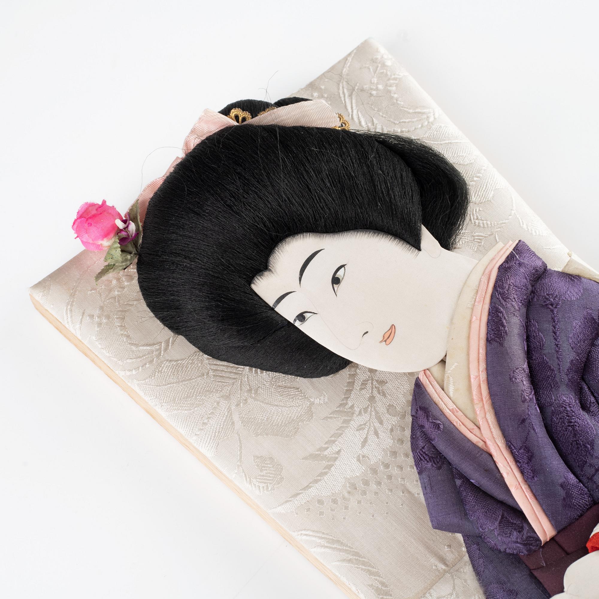 A set of two Japanese hagoita wooden paddles and five shuttlecocks, first part of 20th century.