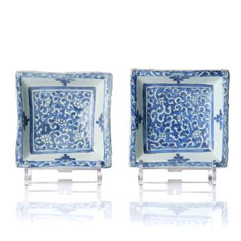 1036. A pair of blue and white 'lotus' dishes, Ming dynasty (1368-1644).