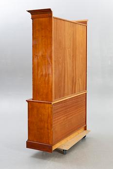 A modern mahogany display cabinet.