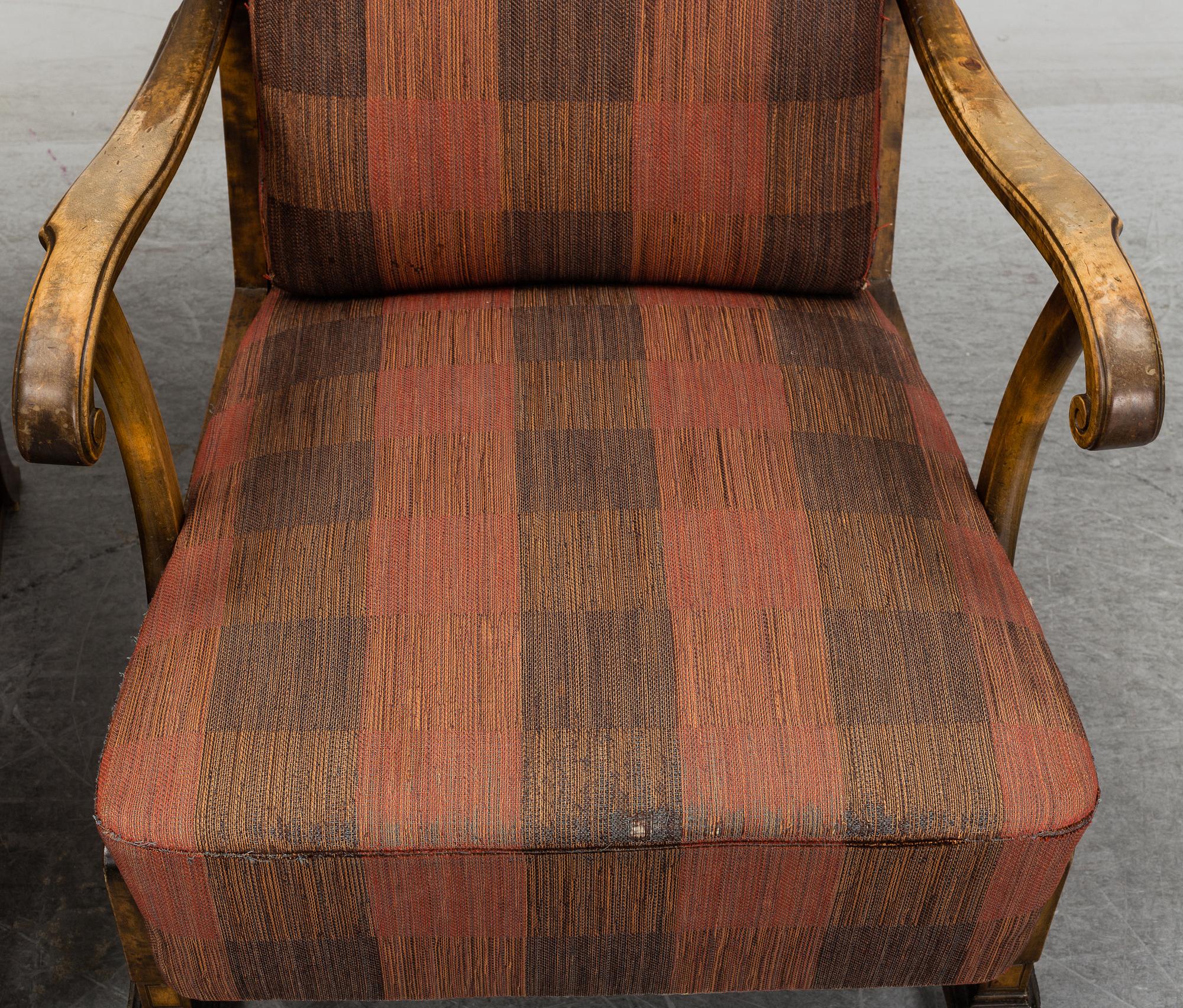 A pair of 1920s easy chairs.