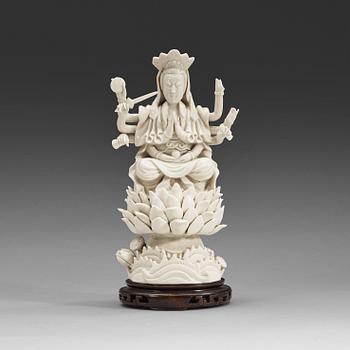 An eigth armed blanc de chine figure of a Bodhisattva, Qing dynasty, 19th Century.