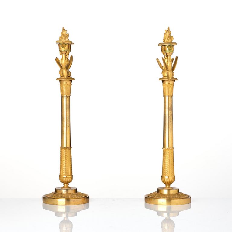 A pair of ormolu three-branch Empire candelabra, early 19th century.