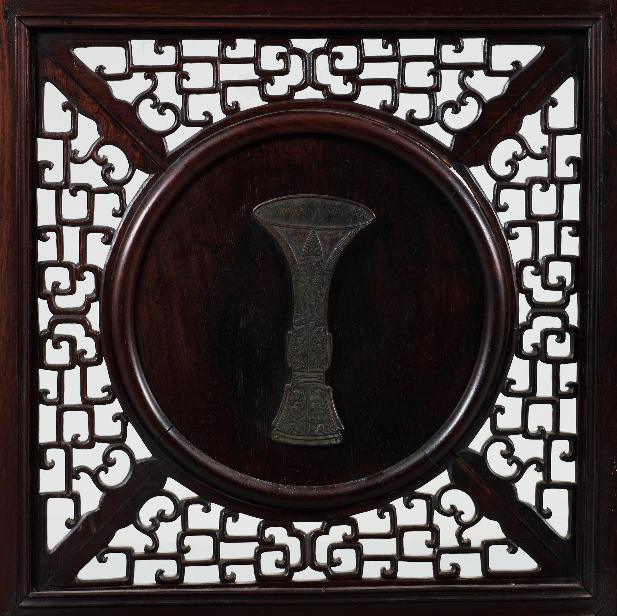 A four panel screen with porcelain placques, Qing dynasty, 19th Century.