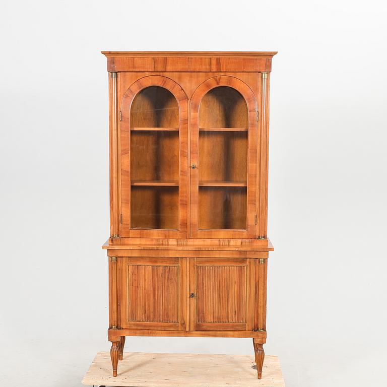 A Louis XVI style walnut display cabinet.