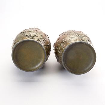 A pair of Japanese 20th century bronze vases.