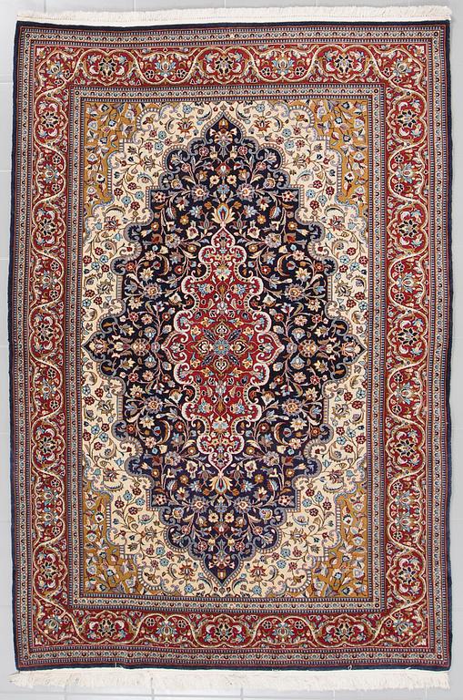 A Ghom rug, 222 x 146 cm.