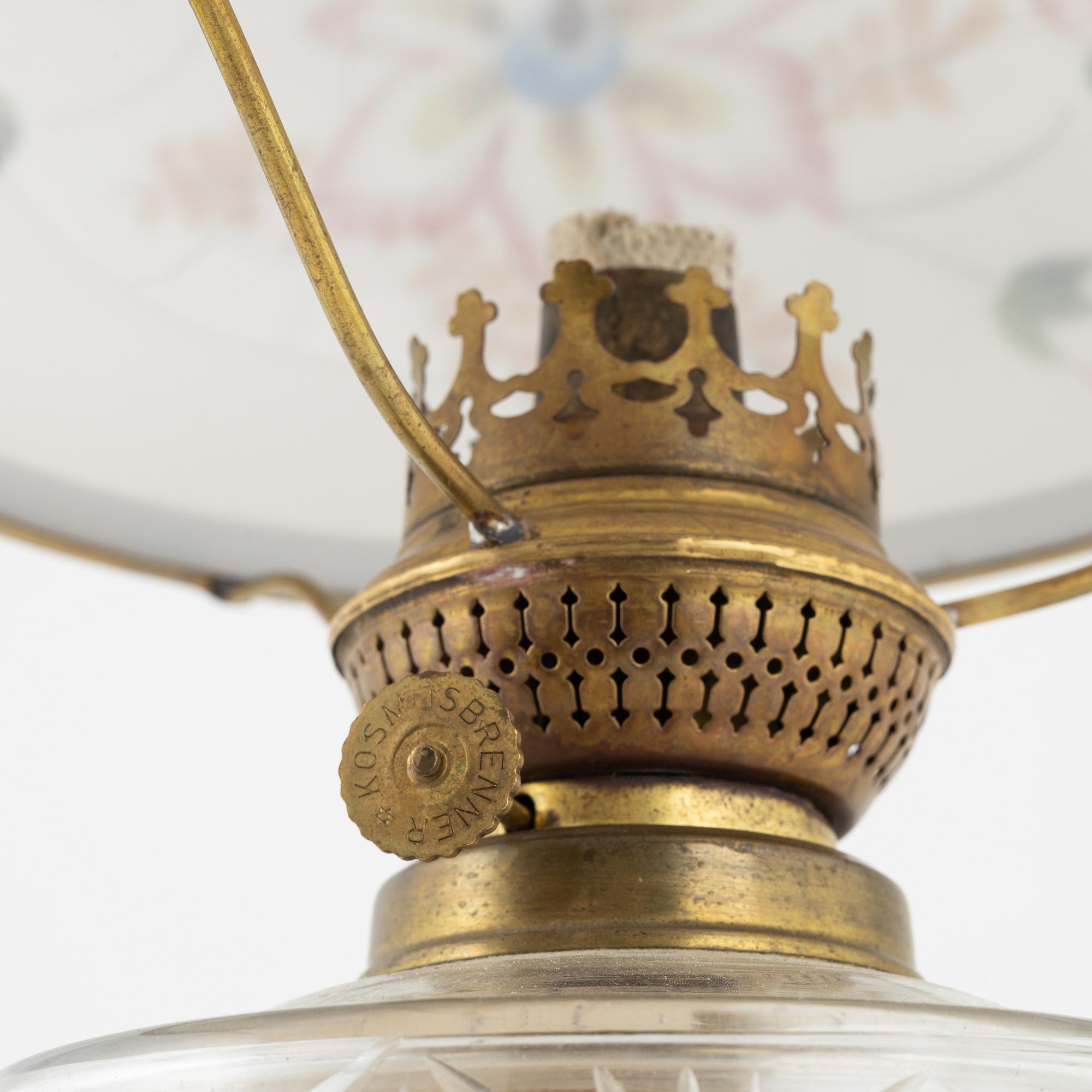 A early 20th century glass kerosene lamp.