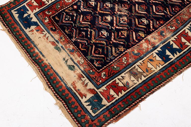 A antique Kazak gallery carpet, ca 310 x 105 cm.