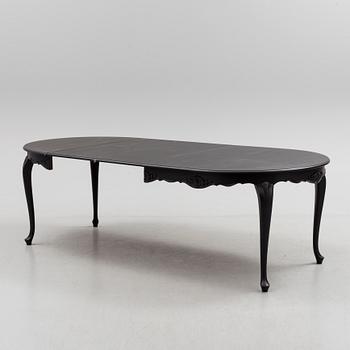 A mid 20th century rococo style dining table.