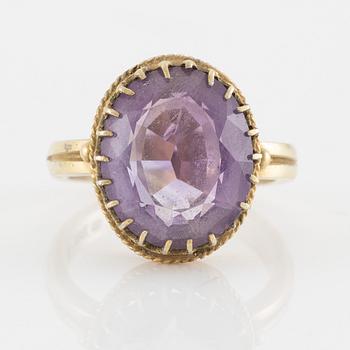 A set with a necklace, a bracelet, a brooch, and a ring.