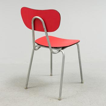 A mid 20th century table and chair.