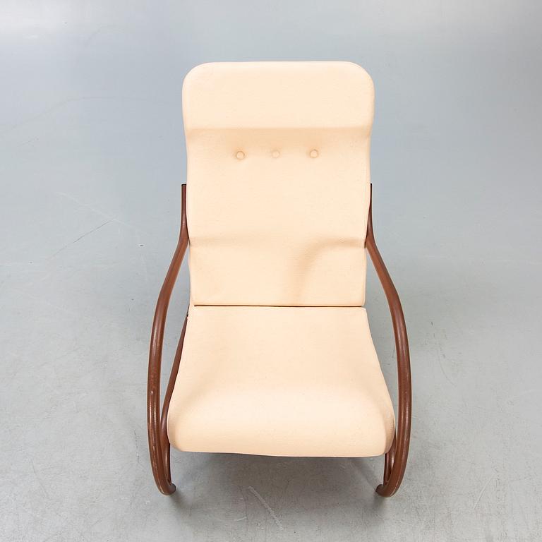 A 1930/40s metal and textile/plastic easy chair.