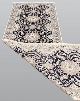 A Nain runner carpet, part silk Sk 6LAA, 337 x 103 cm.
