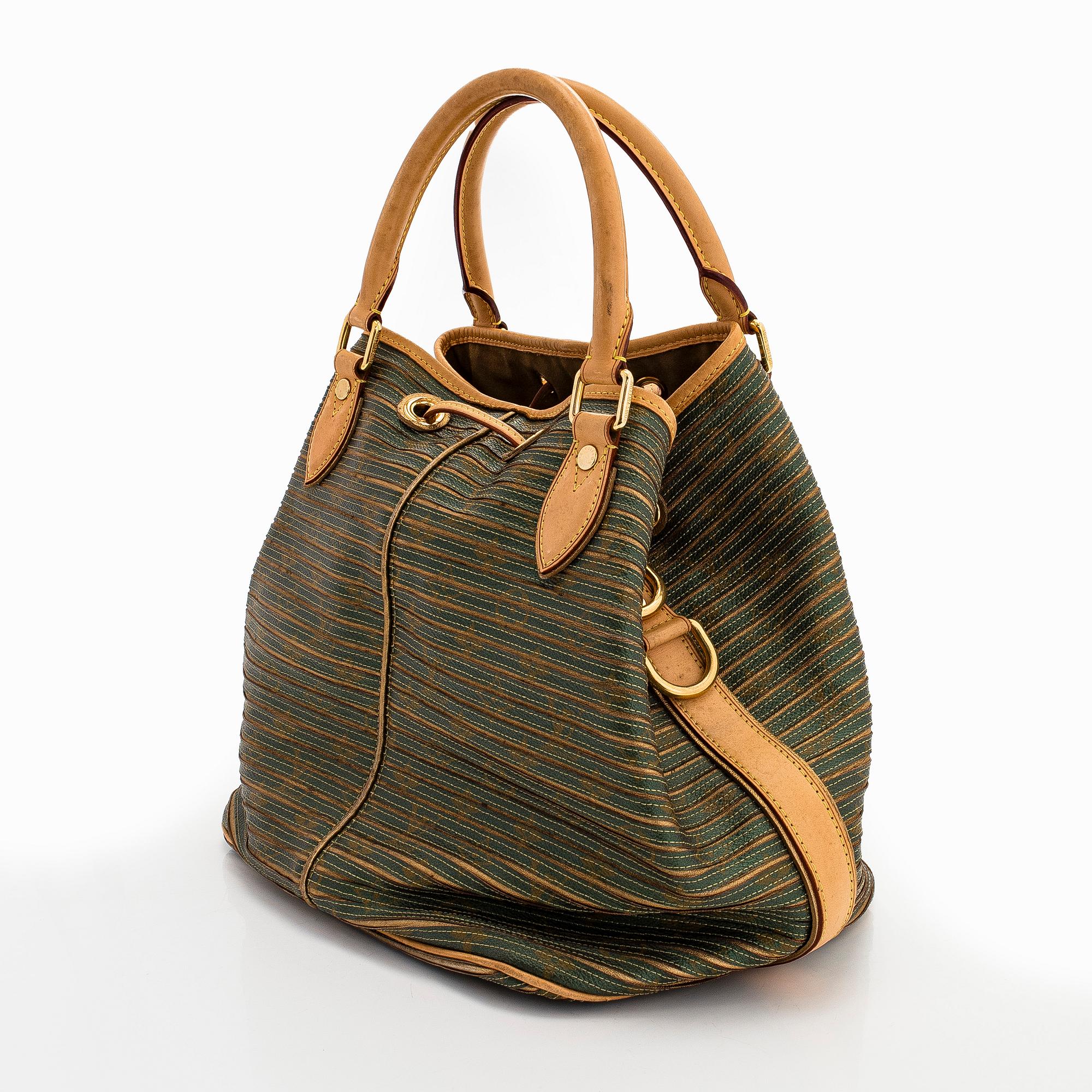 Louis Vuitton, an "Eden Neo" bag.