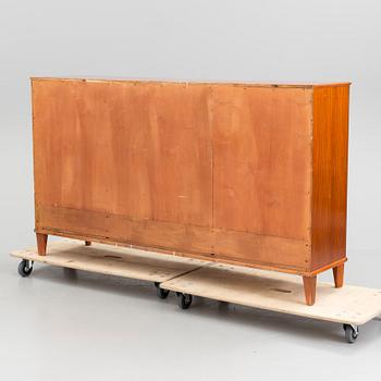 A 20th century mahogany sideboard with four doors.