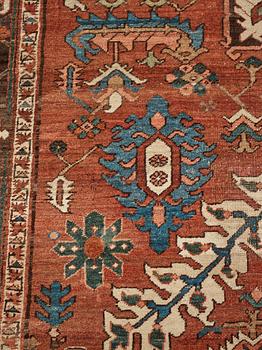 A carpet, an antique Heriz, ca 454,5-460,5 x 268-285 cm.