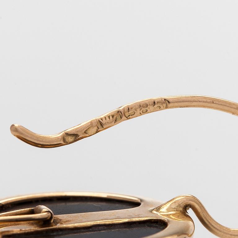 Elis Kauppi, a pair of 14K gold earrings with spectrolite. Kupittaan Kulta, Turku.