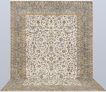 A Keshan carpet, signed, approx. 390 x 282 cm.