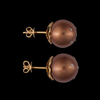 A pair of cultured brown south sea pearls set with brilliant-cut diamonds.