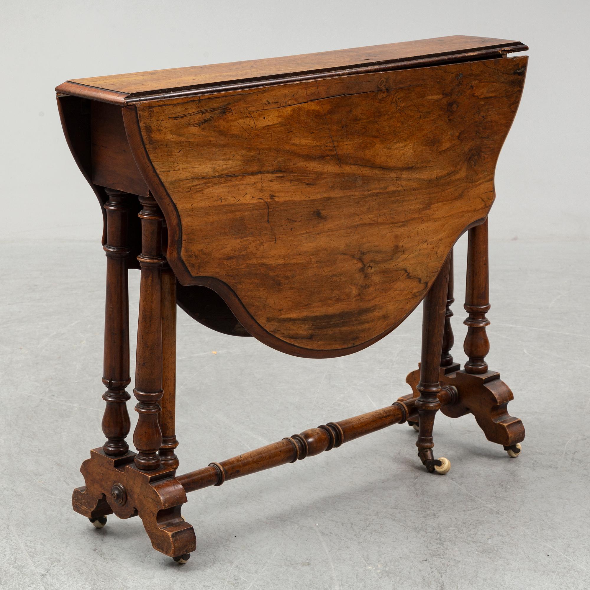 A 19th Century drop leaf table.