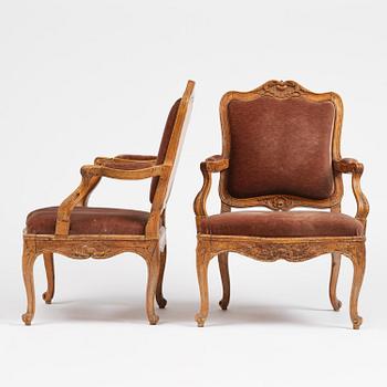 A pair of rococo fauteuils, Stockholm, later part 18th century.