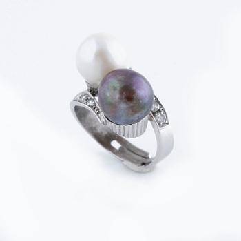 A cultured pearl and single cut diamond ring.