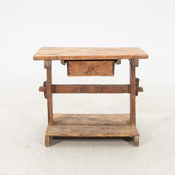 A wooden bench/sideboard from the first half of the 20th century.