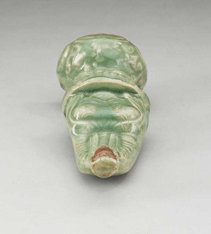 A celadon glazed figure of Guanyin, Ming dynasty.