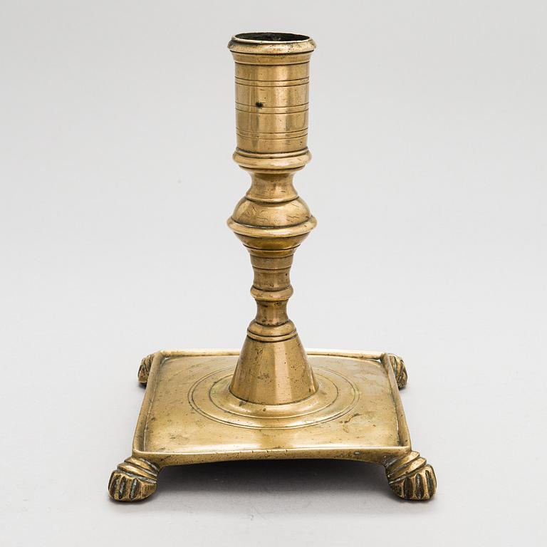 A late 17th century Spanish brass candlestick.