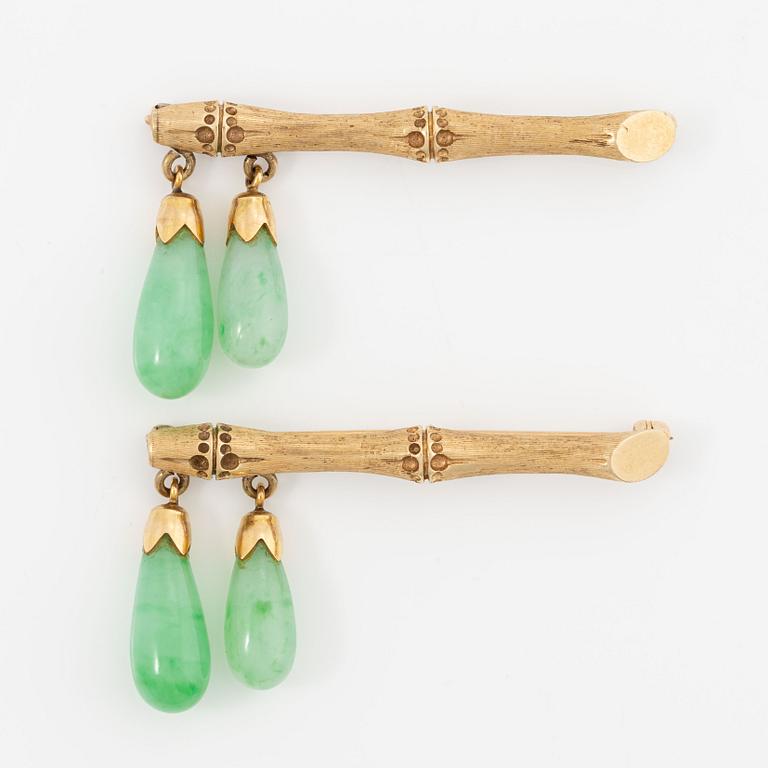 Brooches, a pair, 14K gold in the form of bamboo with jadeite.