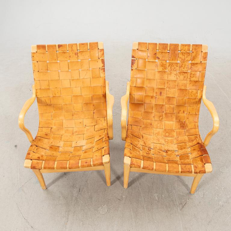 Two 'Eva' easy chairs by Bruno Mathsson for Firma Karl Mathsson dated 1964.