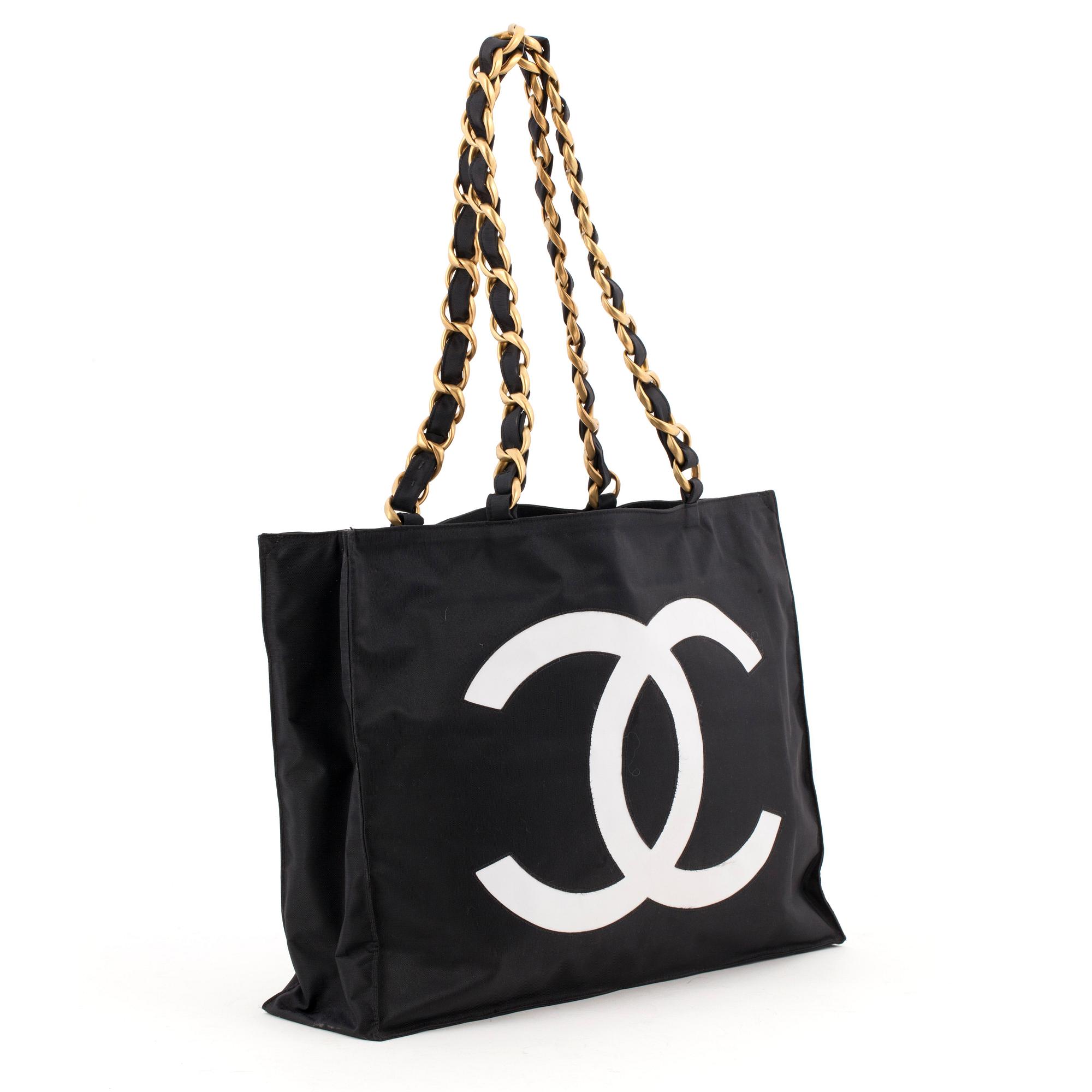 CHANEL, a black nylon bag.