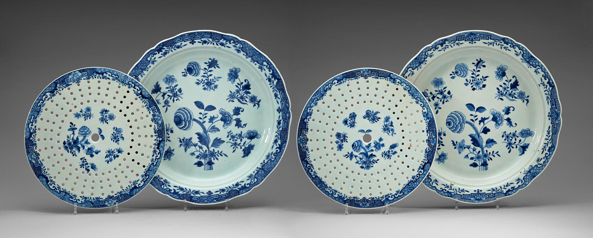 A pair of large blue and white serving dishes with strainers, Qing dynasty, Qianlong (1736-95).