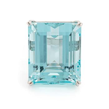 477. An 18K white gold ring set with a step-cut aquamarine.