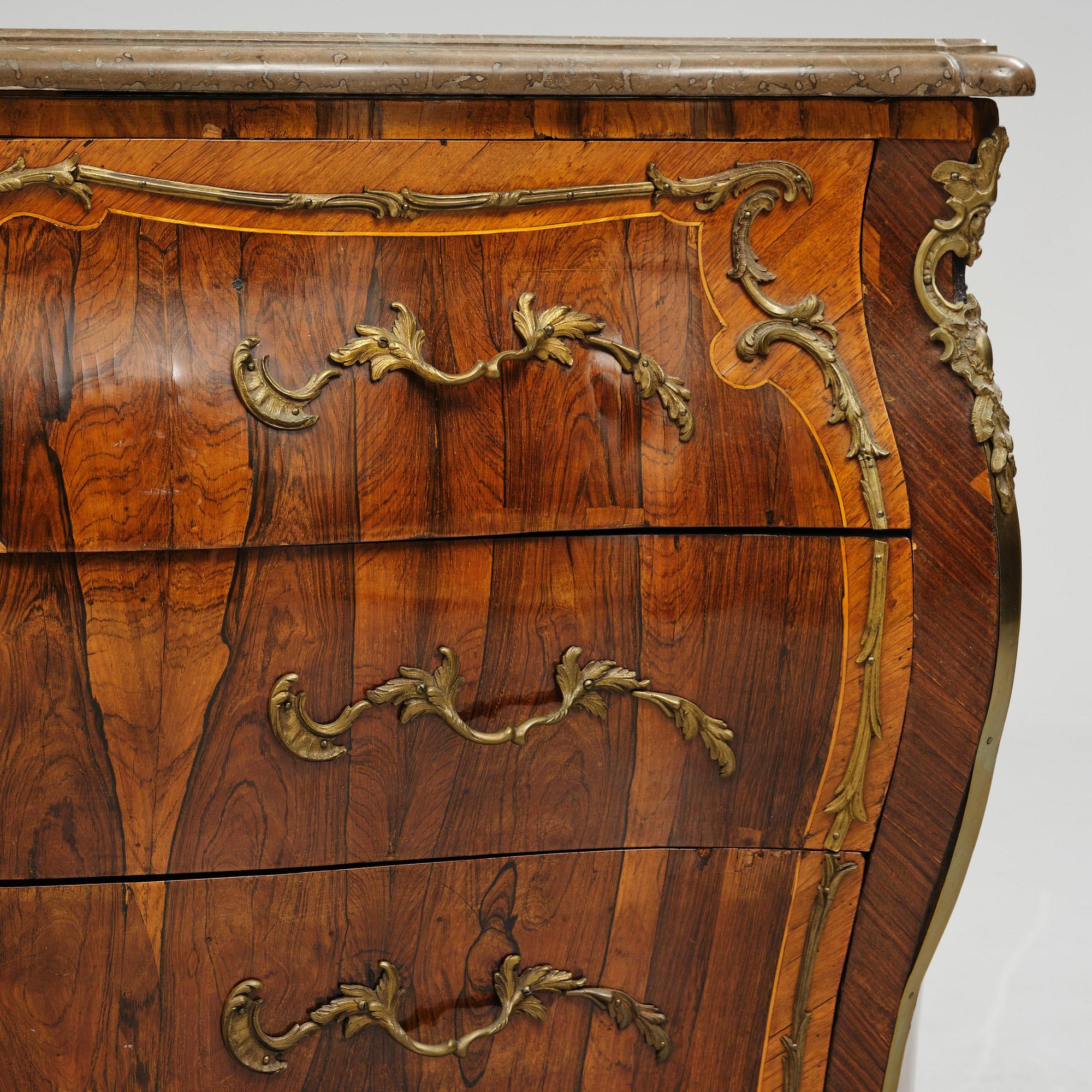 A rococo parquetry commode by C. G. Willkom (master in Stockholm 1763-65).