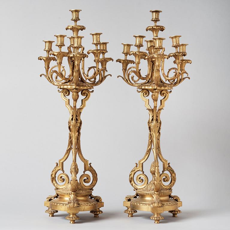 A pair of Louis XVI-style circa 1900 seven-light candelabra.