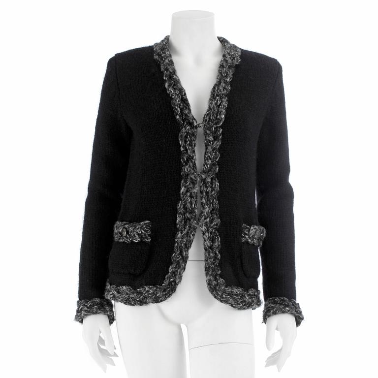 CHANEL, a black woolblend cardigan, size 36.