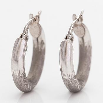A pair of 14K white gold earrings.