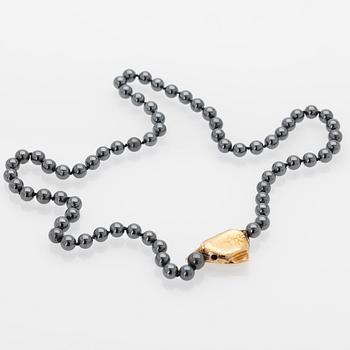 Ole Lynggaard, Hematite necklace with an 18K gold clasp and a diamond.
