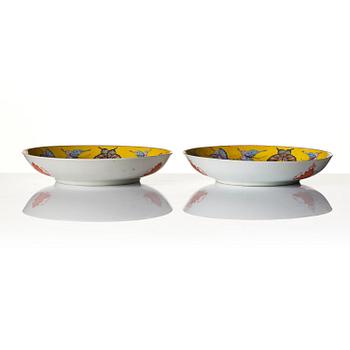 A pair of yellow ground 'butterfly' dishes, late Qing dynasty with Tongzhi mark in red.