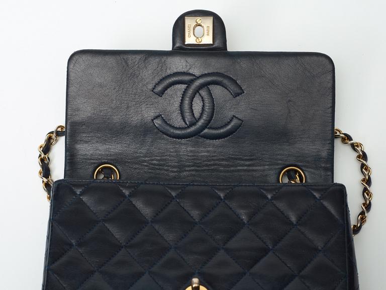 A 1970s black quilt leather shoulder bag by Chanel.